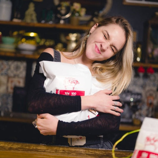Woman holding large bag of beef jerky